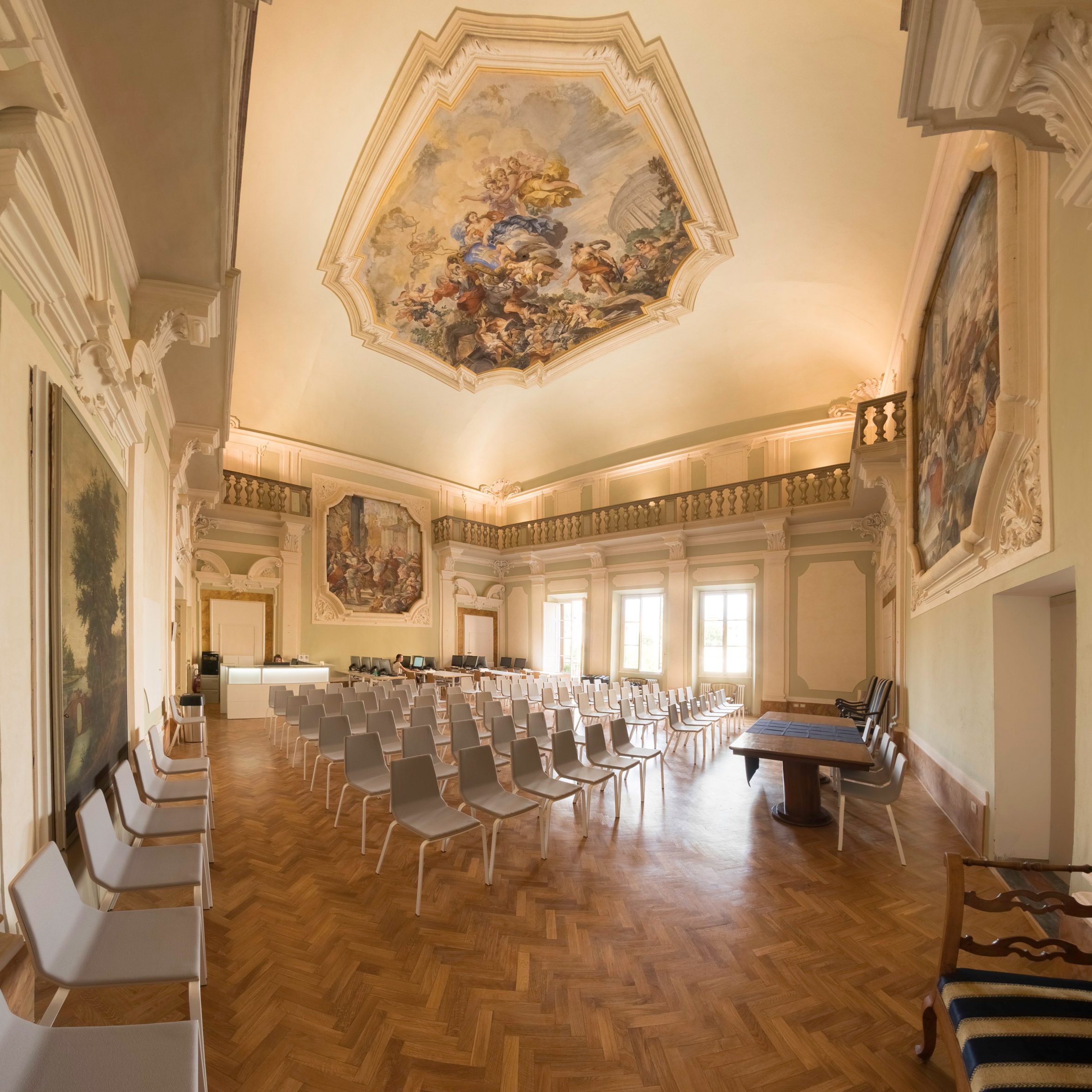 Lecture hall with empty chairs in a neo-classical room