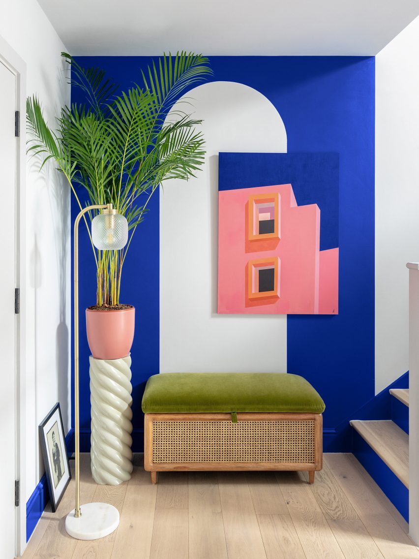 Blue wall and white arch in Moroccan-inspired townhouse by PL Studio