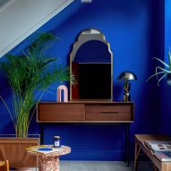 Blue wall and dresser in Moroccan-inspired townhouse by PL Studio