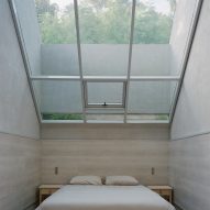 Bedroom with skylight at FR House in the Philippines by CAZA