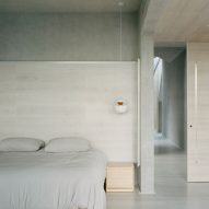 Bedroom with concrete wall