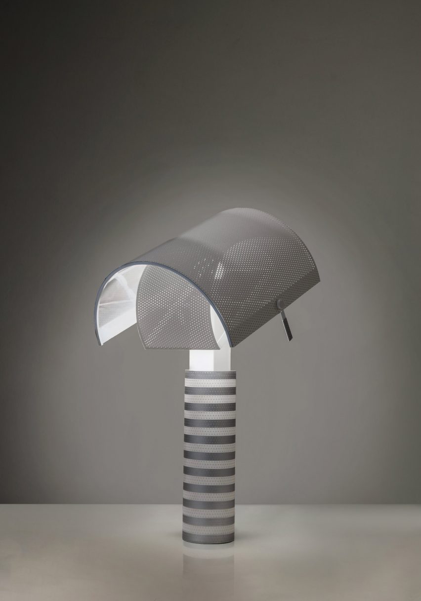 Striped perforated lamp in a darkened room