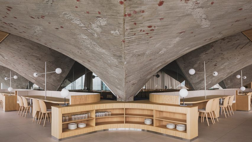 Concrete paraboloid inside brutalist restaurant in Spain by Zooco Estudio