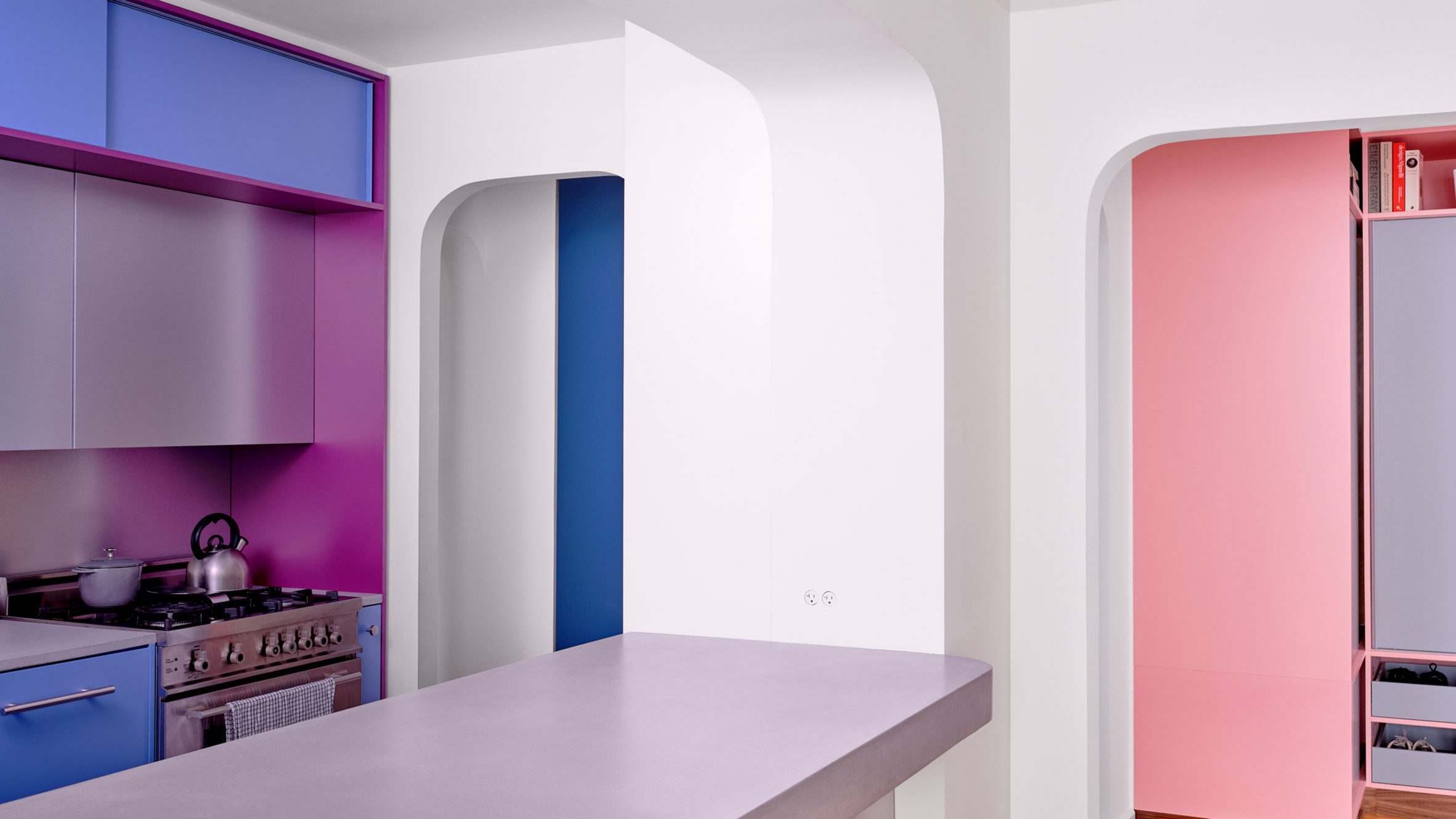 Kitchen viewed through an arched opening