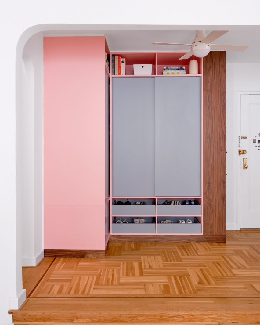 Pink and grey built-in storage in an entryway