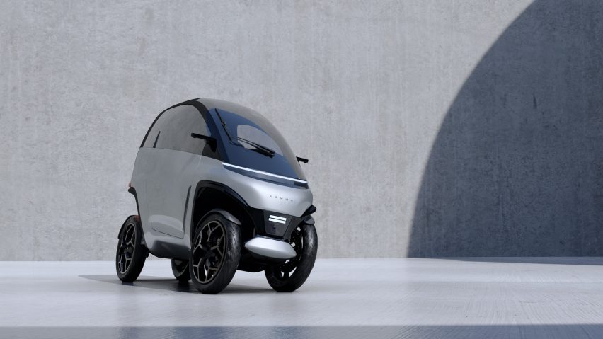Rendering of the Komma vehicle — narrow like a scooter but with four wheels and enclosed like a car
