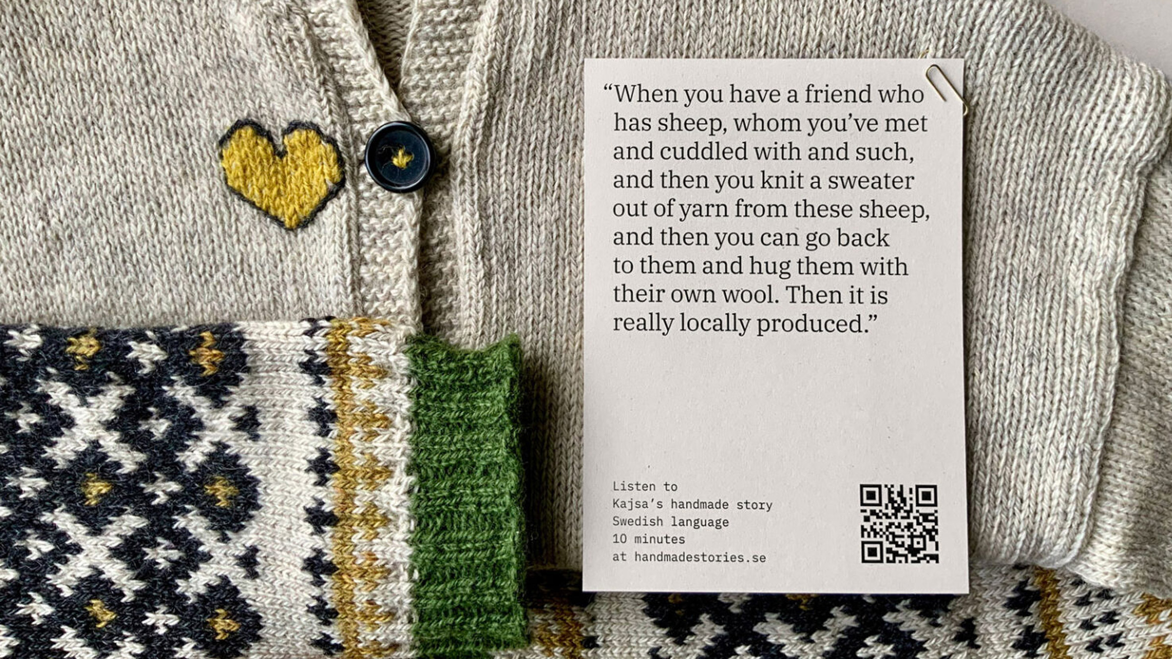 Photograph of a woollen jumper with a piece of paper attached to it