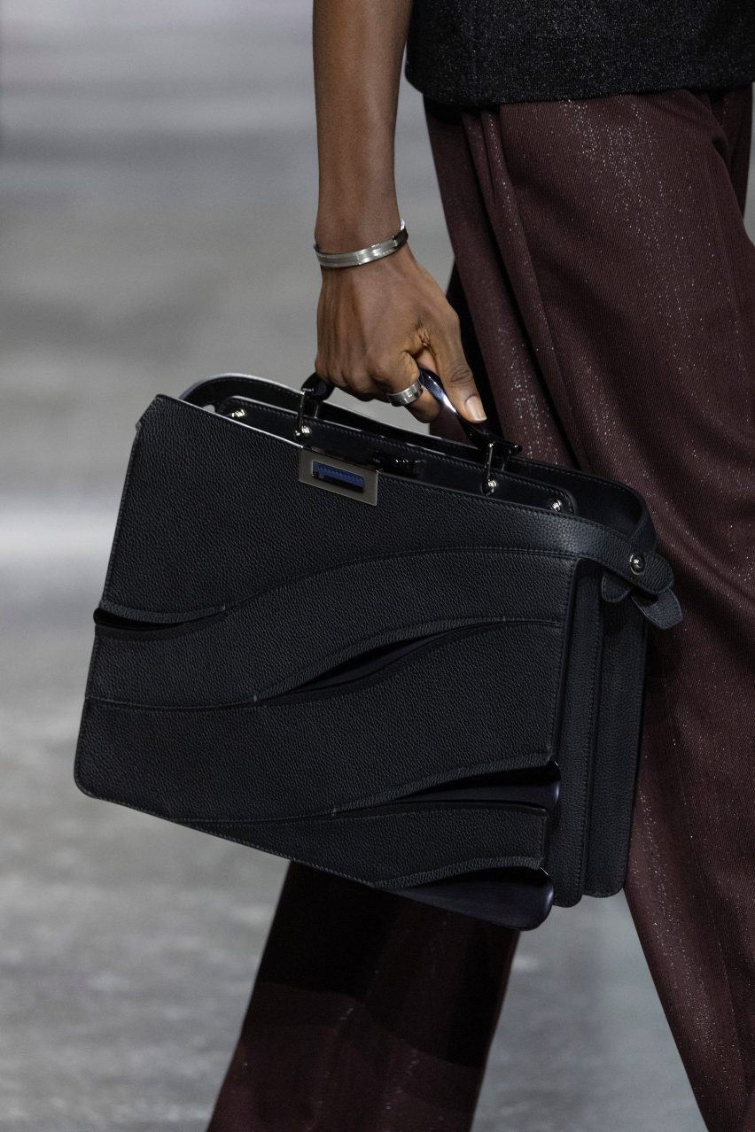 Close-up of model holding black Peekaboo bag designed by Ma Yansong of MAD Architects for Fendi