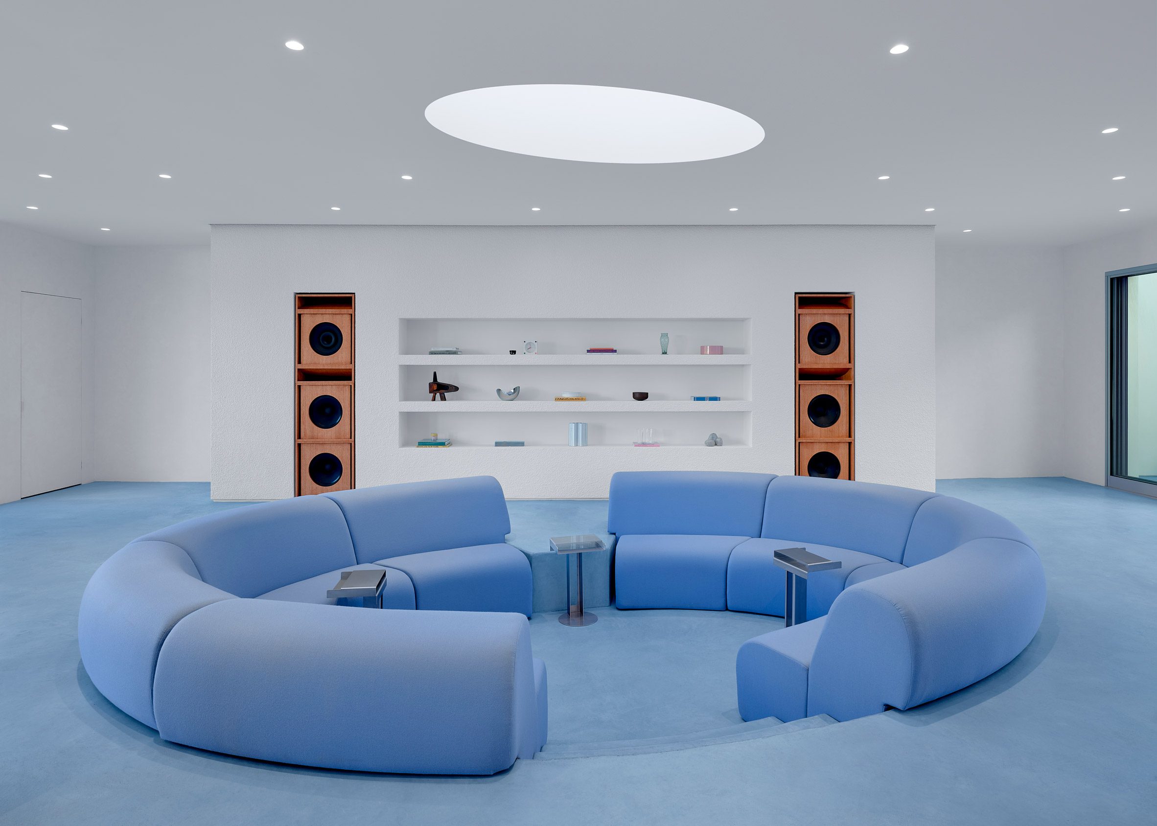 a conversation pit made of light blue seating