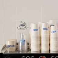 paper cups on top of espresso machine