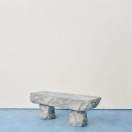 a gray stone bench