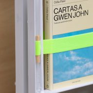 A book bound in place with green elastic