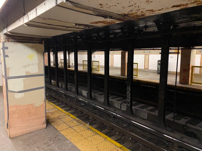 Yellow barriers lining a subway station in New York