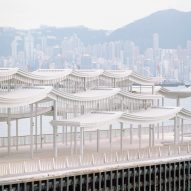 Promenade on a Hong Kong harbour with a curving steel canopy