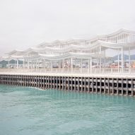 Promenade on a Hong Kong harbour with an undulating roof