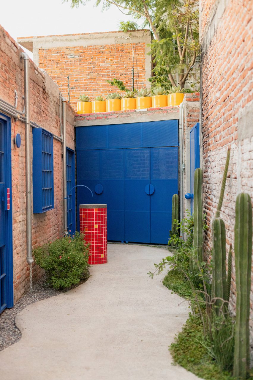 Blue doorway in alleyway