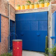 bright blue window and door in an alley