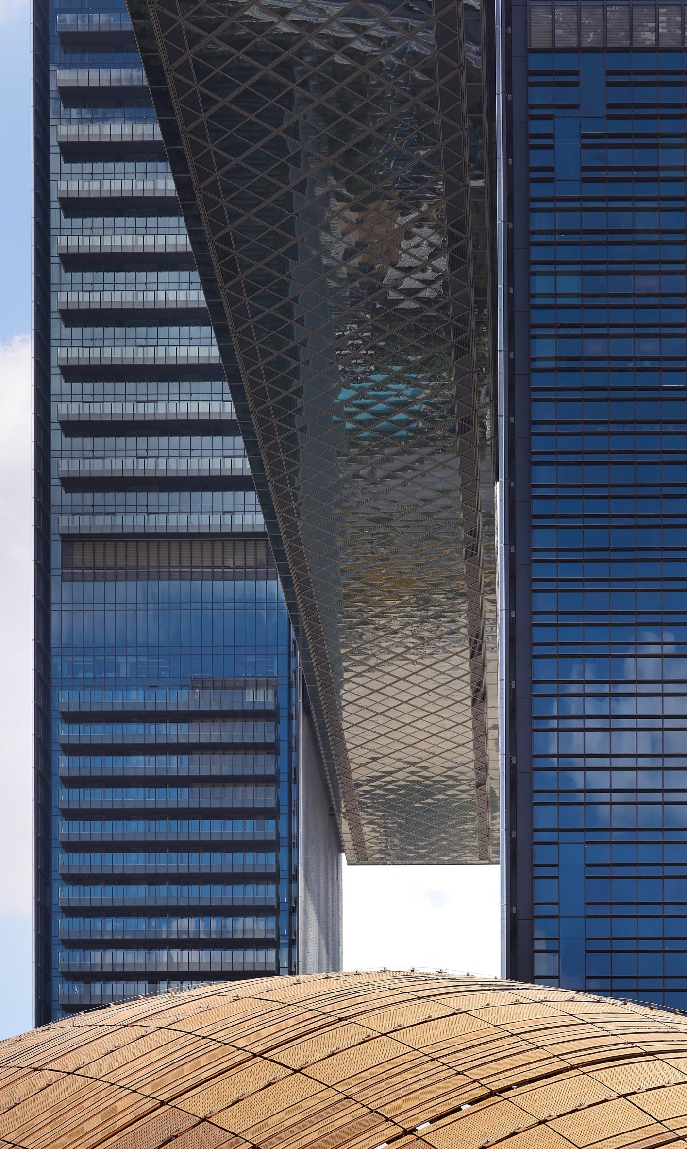 Two glass towers linked by sky bridge