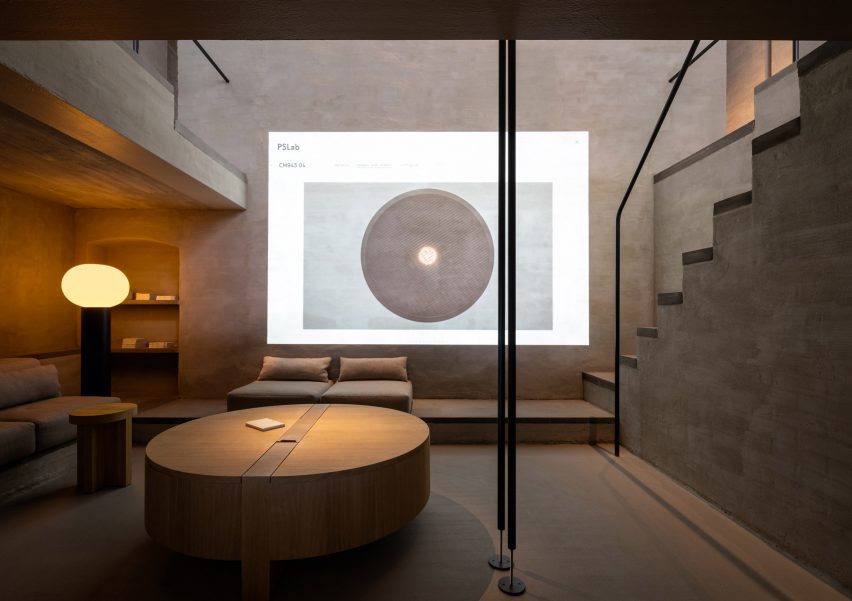 Lounge inside lighting showroom by B-bis architecten