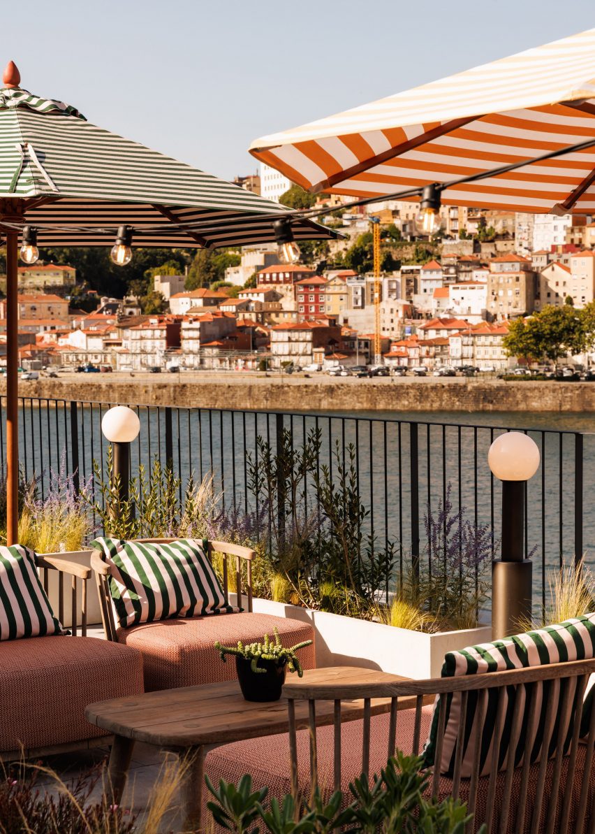Lounge chairs under umbrellas overlooking the Douro River