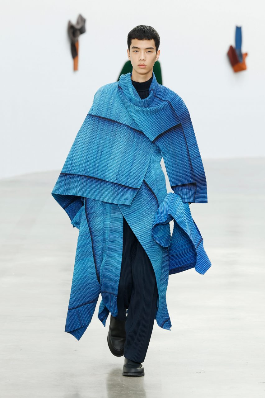 Model wearing all-blue outfit from Issey Miyake Homme Plissé AW24 collection