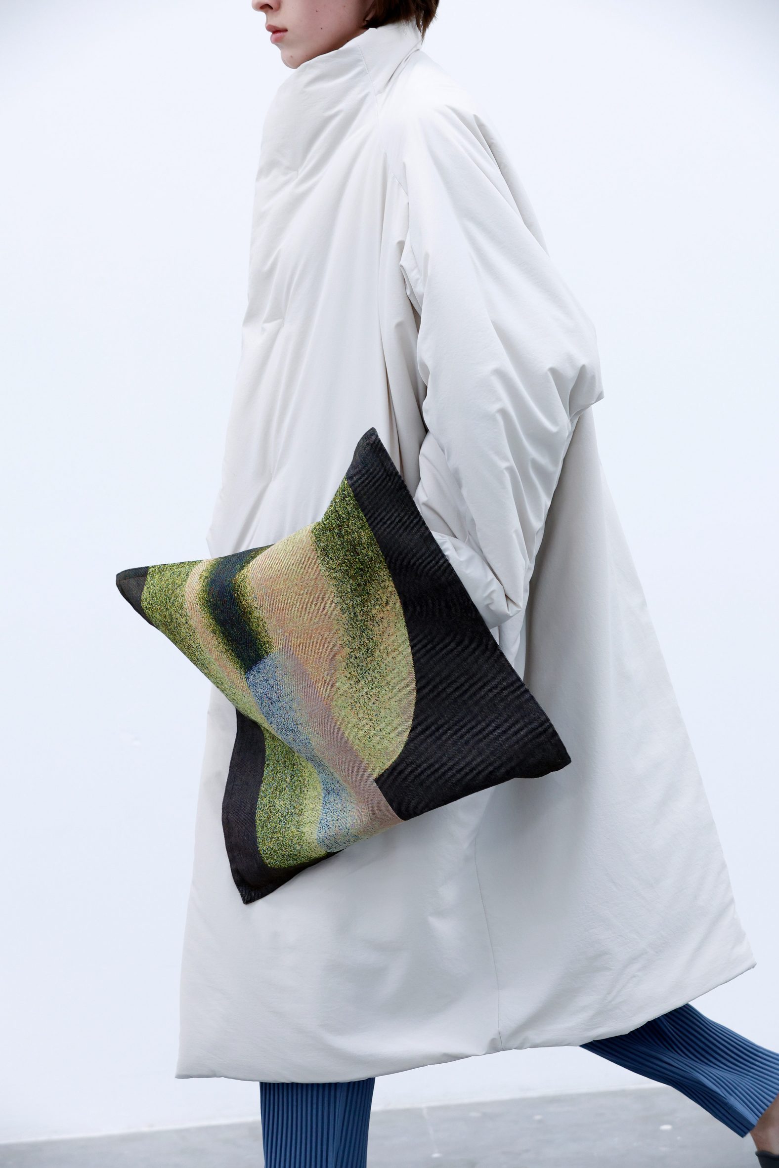 Puffer coat with giant oversized pocket from fashion collection in collaboration with Ronan Bouroullec