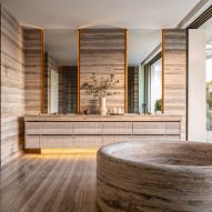 A bathroom made of stone with circular bath