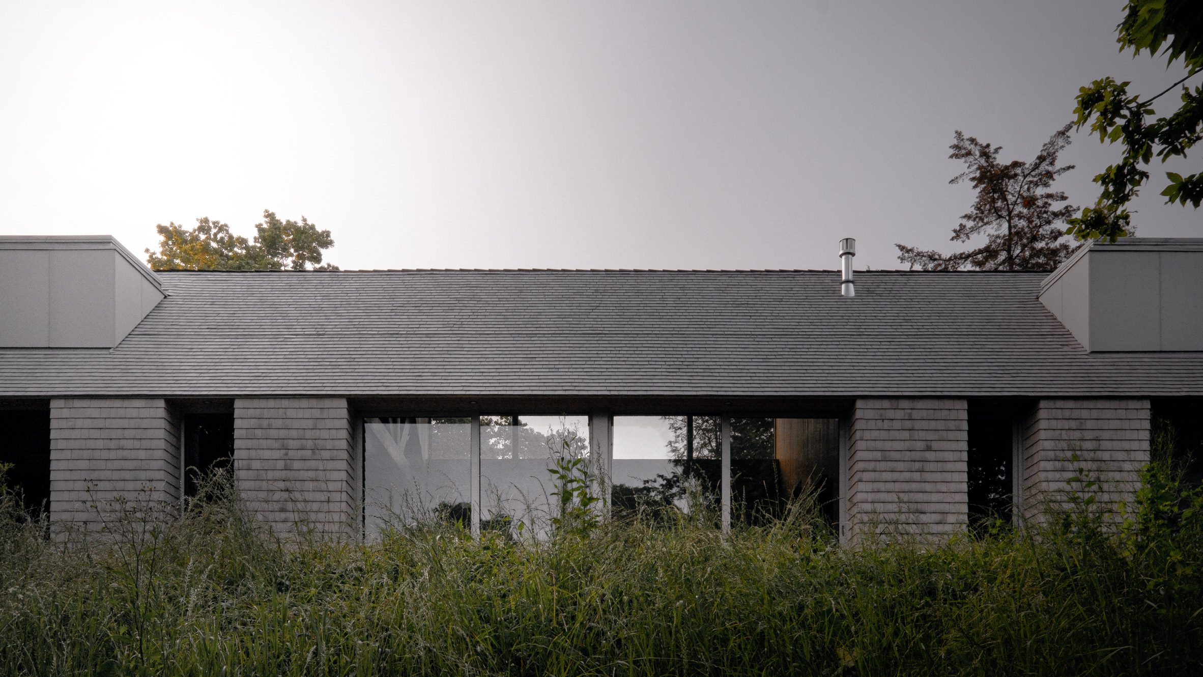 StudioAC places cedar-clad house on natural ridge in Ontario