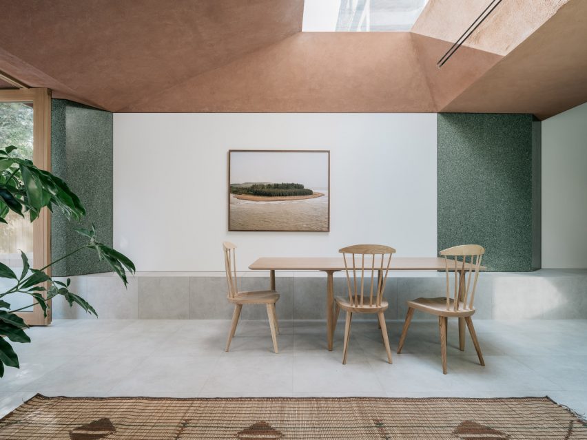 Dining room with plaster ceiling and green-terrazzo walls