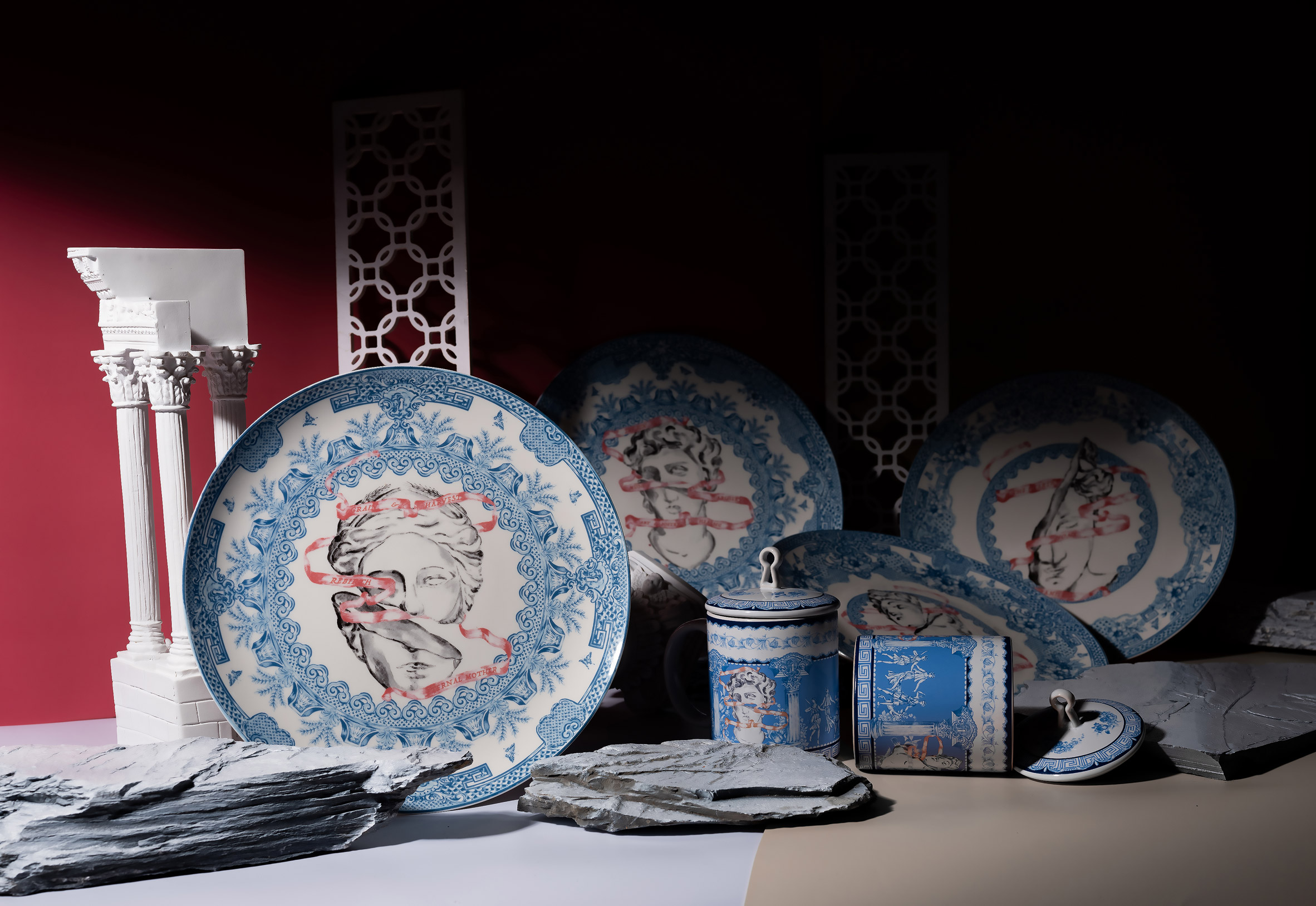 Blue and white china plates on dark backdrop