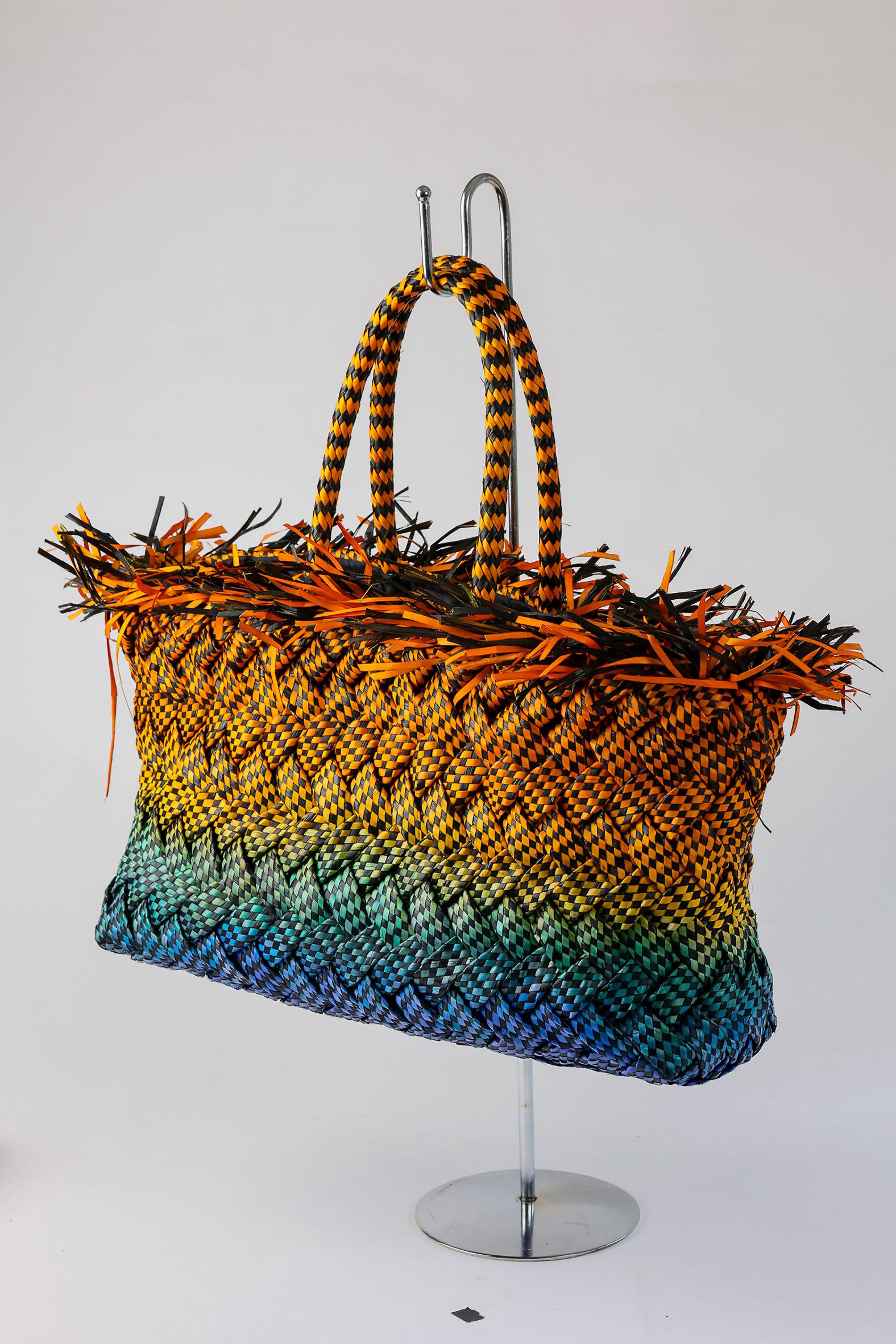 Rainbow-coloured woven bag