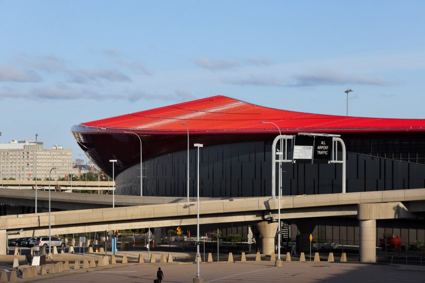 Red roof of Boston airport with highway interchange in foreground