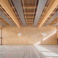 Sports hall with concrete flooring and timber walls