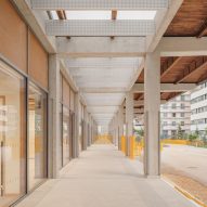School with a concrete structure and perforated brick walls