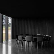 Dining room with charred timber wall cladding