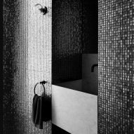 Black mosaic-tiled bathroom