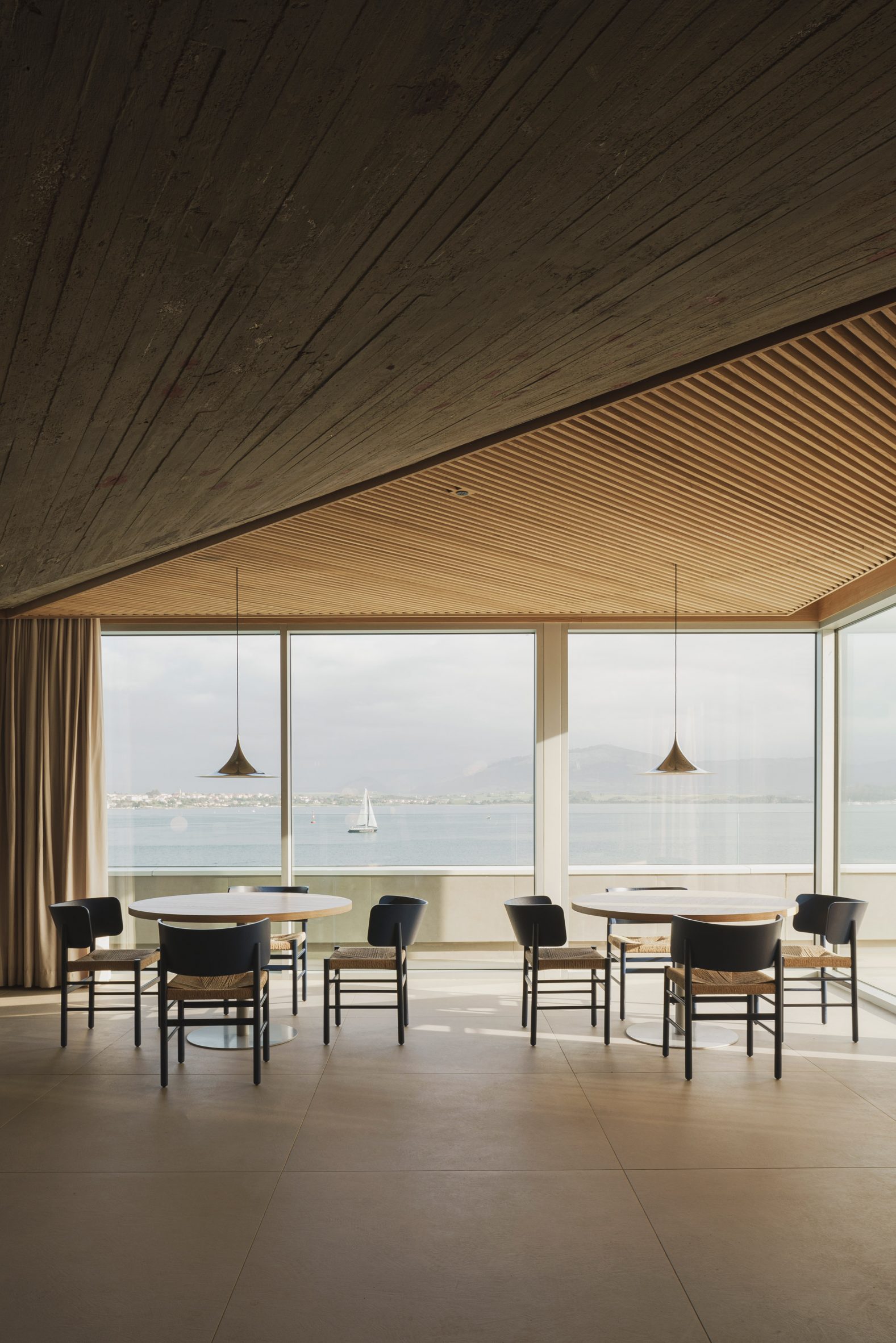 Dining tables overlooking views of the Santander bay