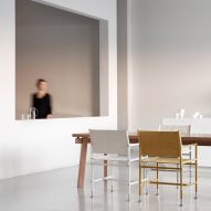 A dining table with two Able chairs by Blå Station