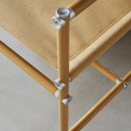 Close up of the yellow lacquered metal frame of an Able chair by Blå Station