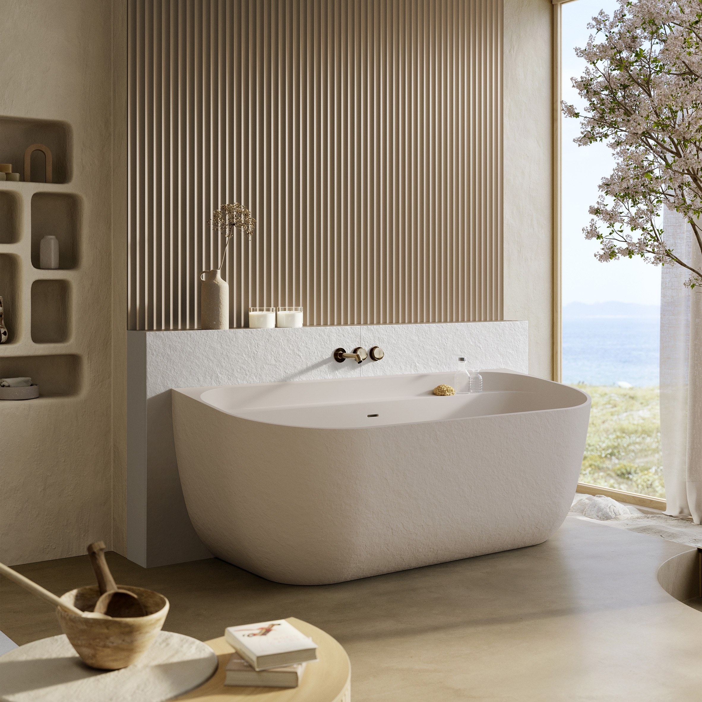Photo of a large, pale pink built-in bathtub in a luxurious bathroom