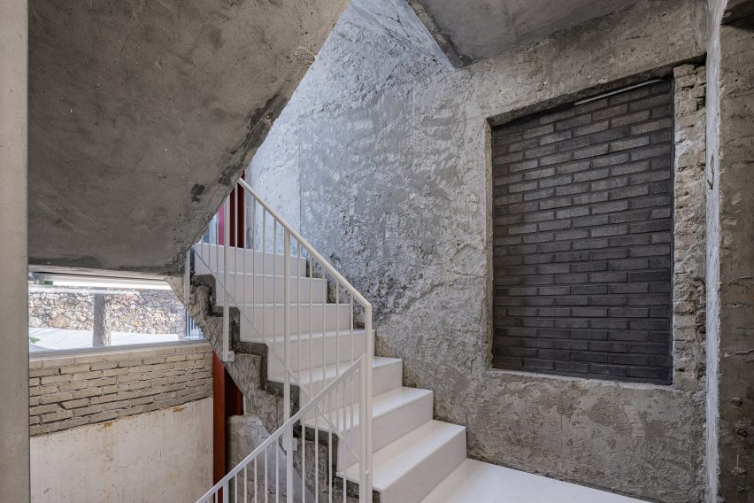 Concrete stairwell with white stairs