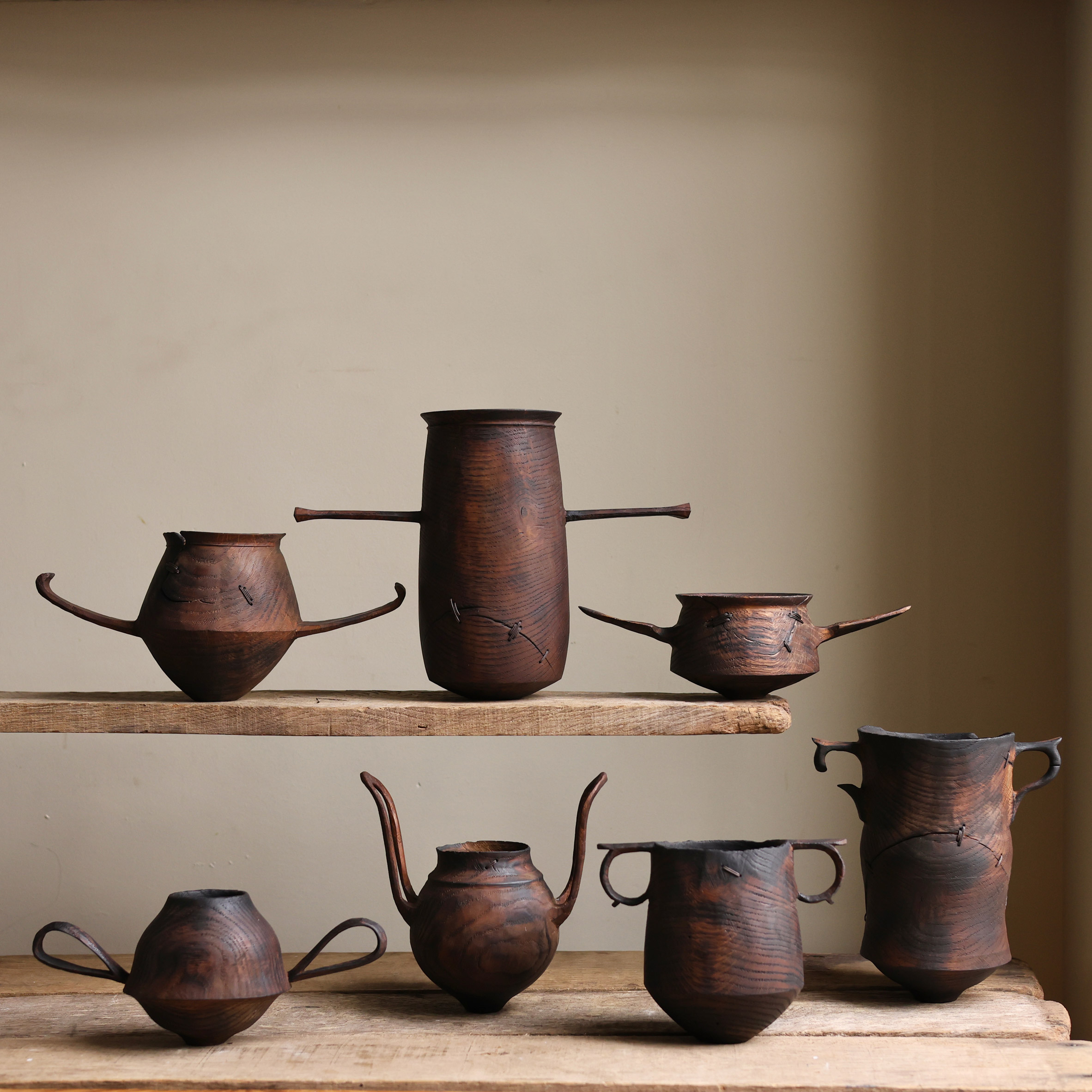 Series of seven small wooden vessels