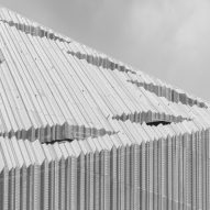 Pleated aluminium facade at the Bonfiglioli headquarters by Peter Pichler Architecture