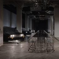 Black cars surround furniture by Willo Perron and USM in Sized Selects exhibition