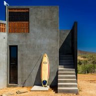 RED Arquitectos integrates corn millstone into facade of Mexican house