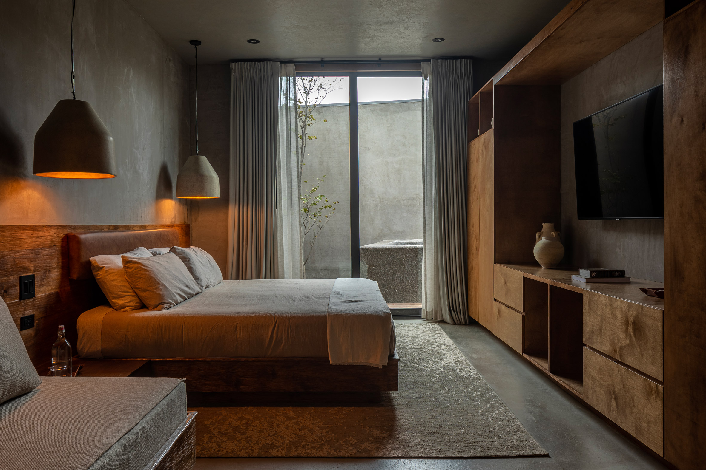 Concrete-walled bedroom by Cesar Mancillas