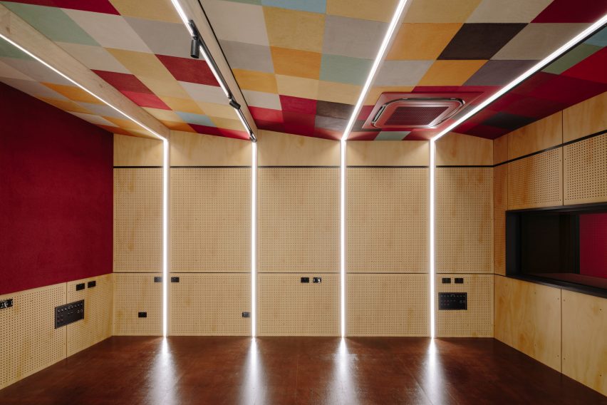 Red Composition acoustic wall coverings by Autex in school