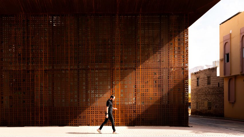 Photo of the exterior of Design Space AlUla in Suaid Arabia showing the cut-out patterns on its Corten steel facade