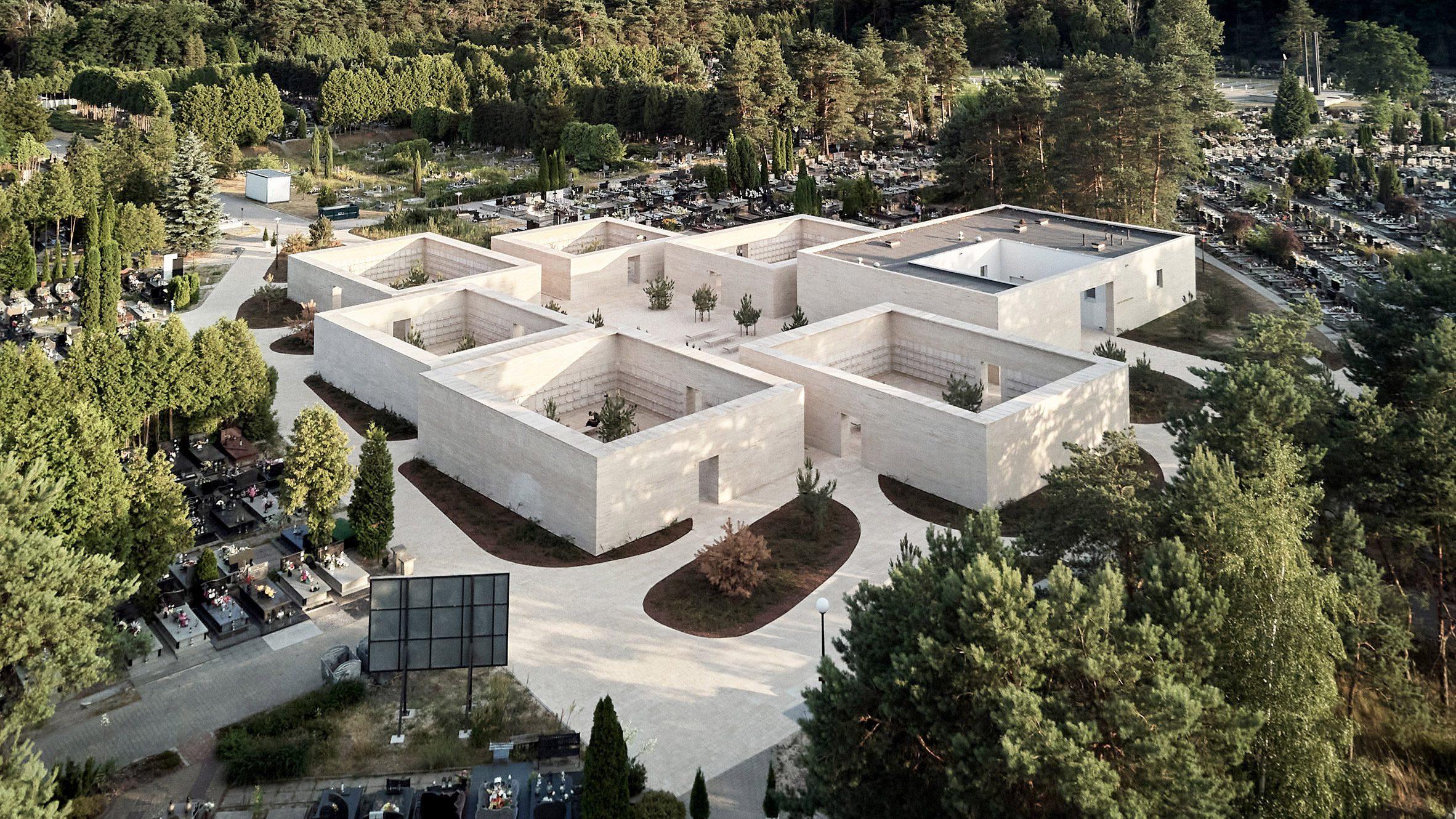 BDR Architekci clads columbarium in Poland with pale sandstone - Vimarsana News