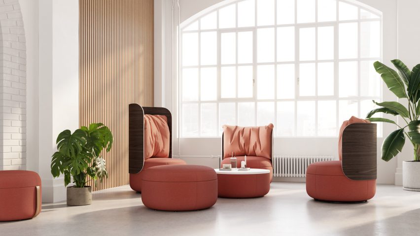 Three curvilinear lounge chairs from KFI Studio's Dotti collection with coral upholstery